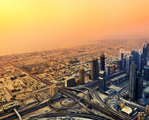 Dubai skyline along Sheikh Zayed Road at sunset