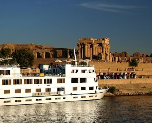 What to See Along the Nile River - A Nile Cruiser docked at the Temple of Kom Ombo on the River Nile