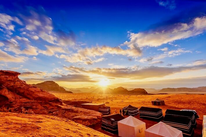 Jordan Tour Packages from Dubai - Scenic view of the Jordanian desert at sunset in Wadi Rum, Jordan
