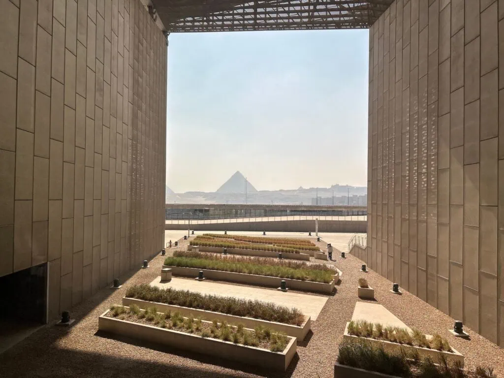 A stunning view of the pyramids as seen from the main hall of the Grand Egyptian Museum