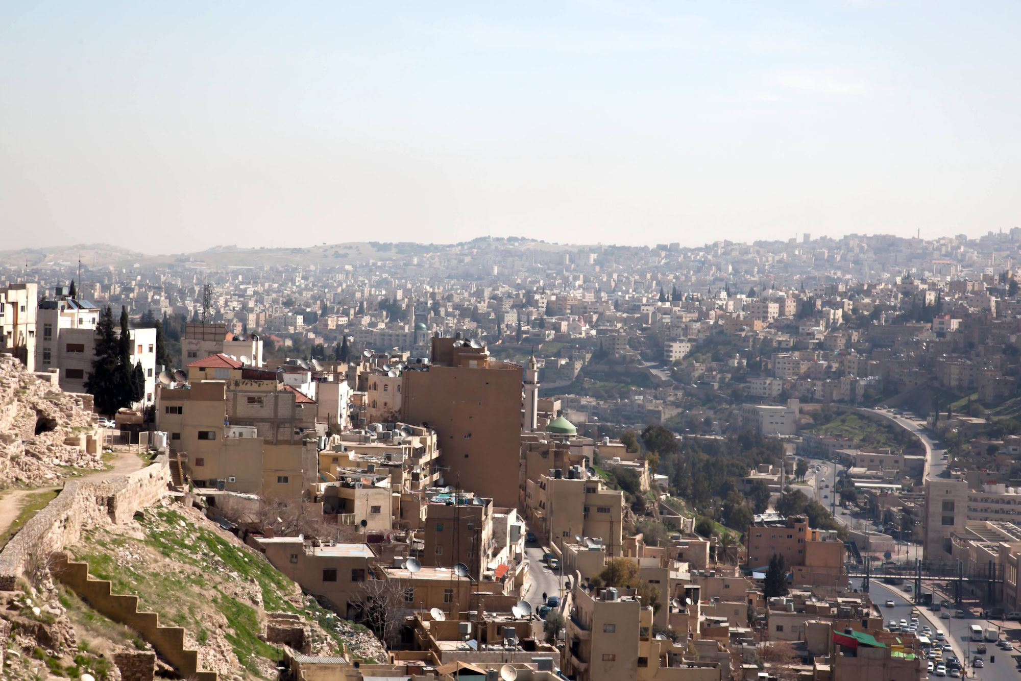 Panoramic view of Amman Citadel with ancient ruins overlooking diverse urban landscape and hills