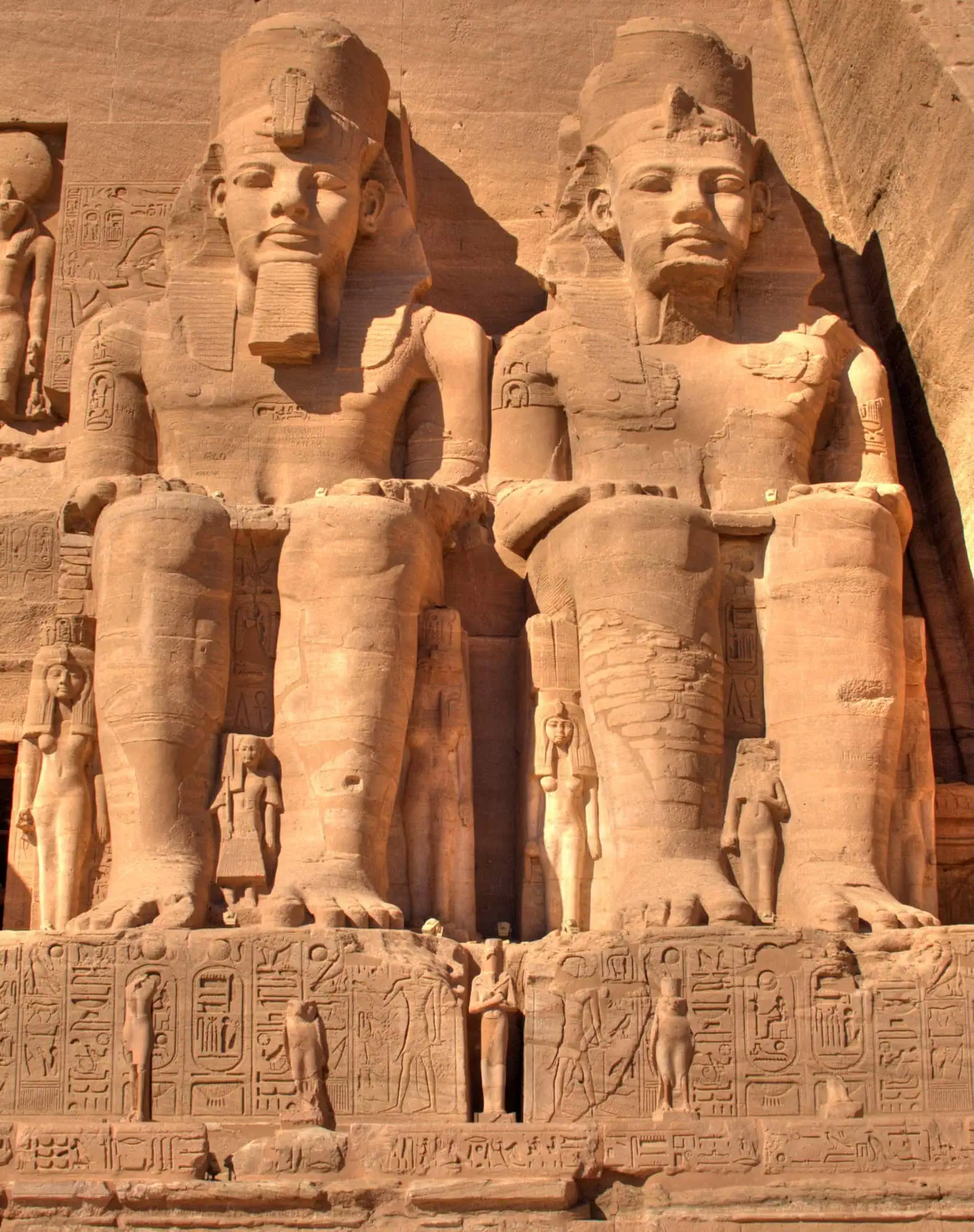 Colossal statues and hieroglyphic carvings at the Great Temple of Abu Simbel facade