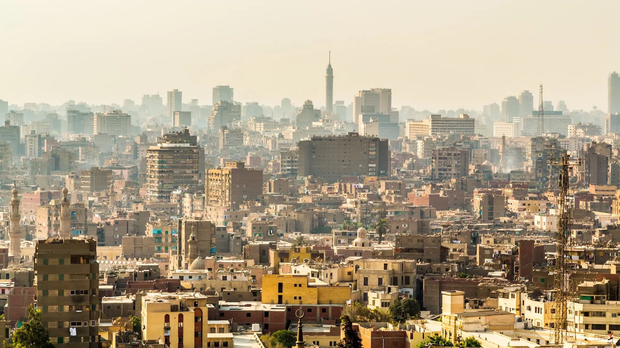 Cairo cityscape showing dense urban development with modern skyscrapers and Cairo Tower