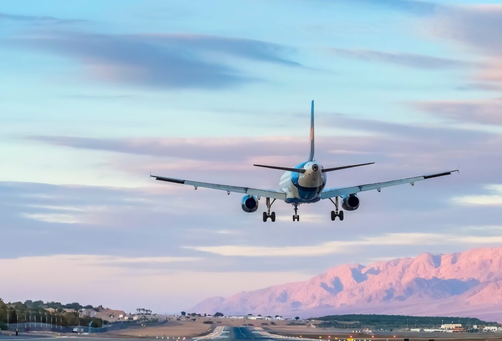Airplane taking off above the runway