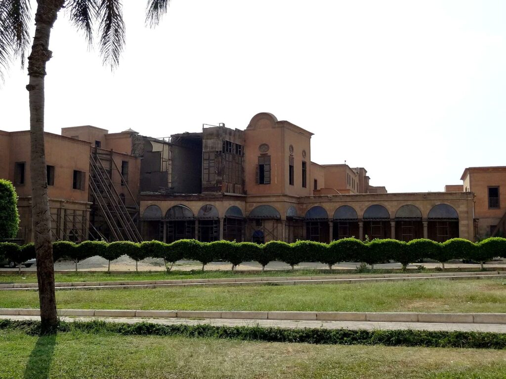Exterior view of Al Gawhara Palace with arched colonnade and garden foreground within the Citadel, Cairo
