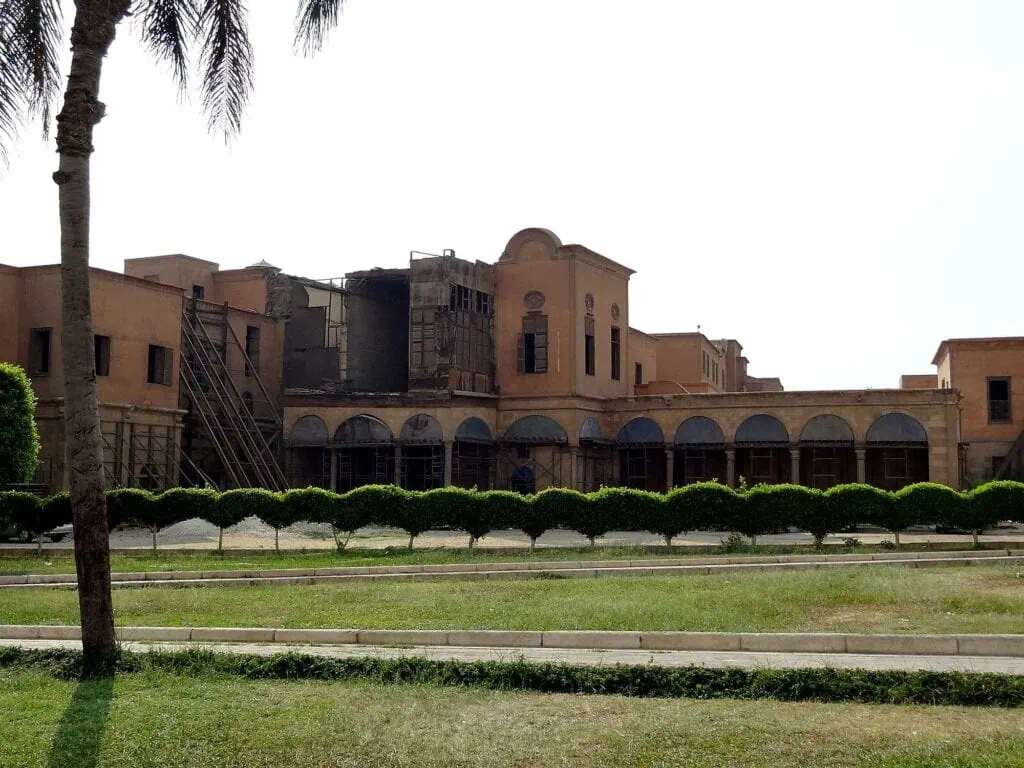 Exterior view of Al Gawhara Palace with arched colonnade and garden foreground within the Citadel, Cairo