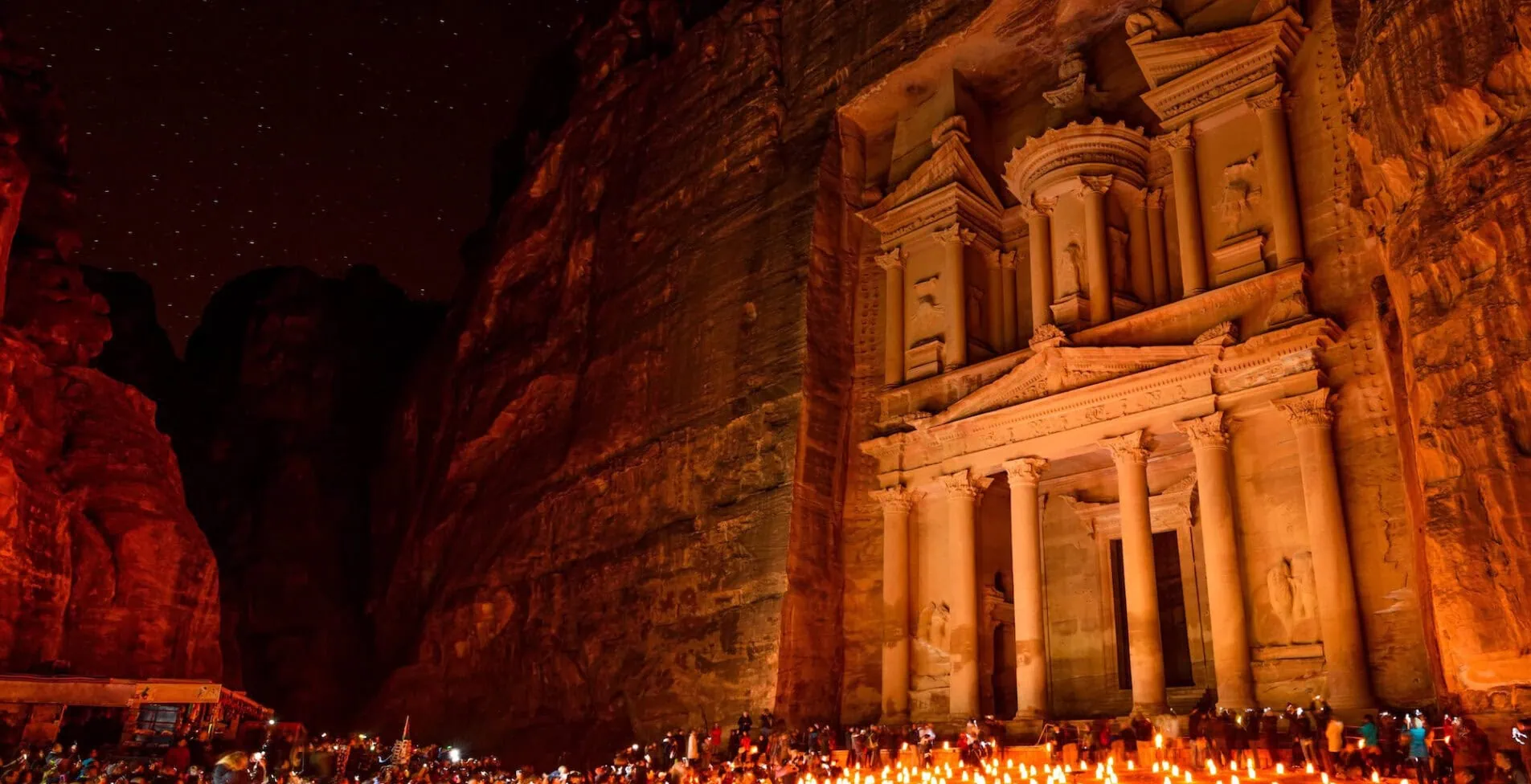 Al Khazneh in the ancient city of Petra Jordan at night. It is known as The Treasury. Petra has led to its designation as a UNESCO World Heritage Site