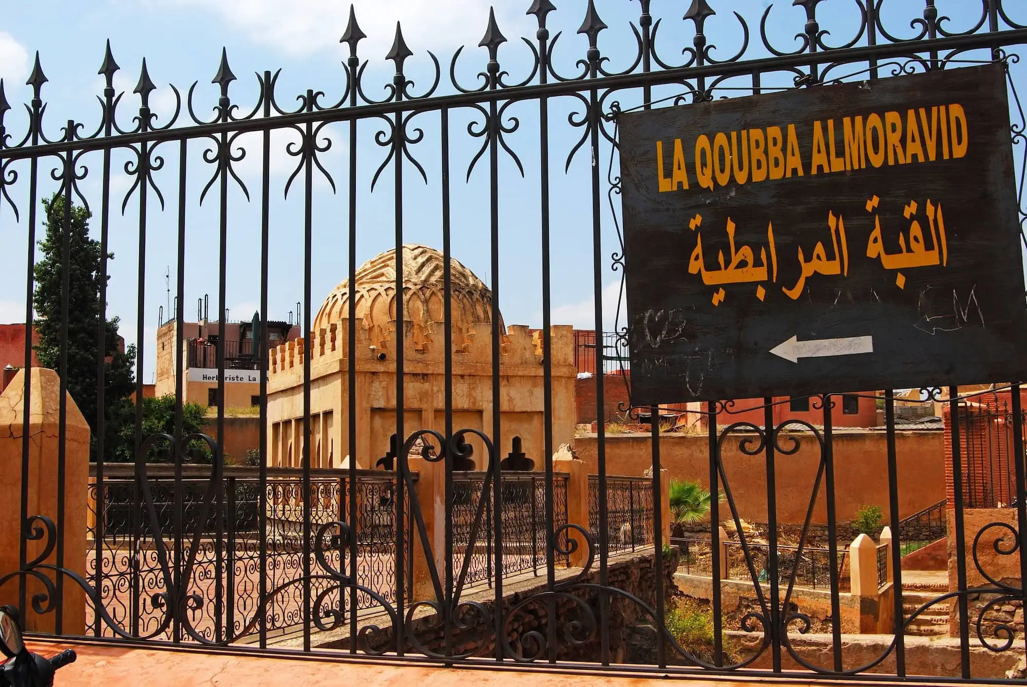 Historic Almoravid Koubba dome structure with Islamic architecture and decorative stonework in Marrakech