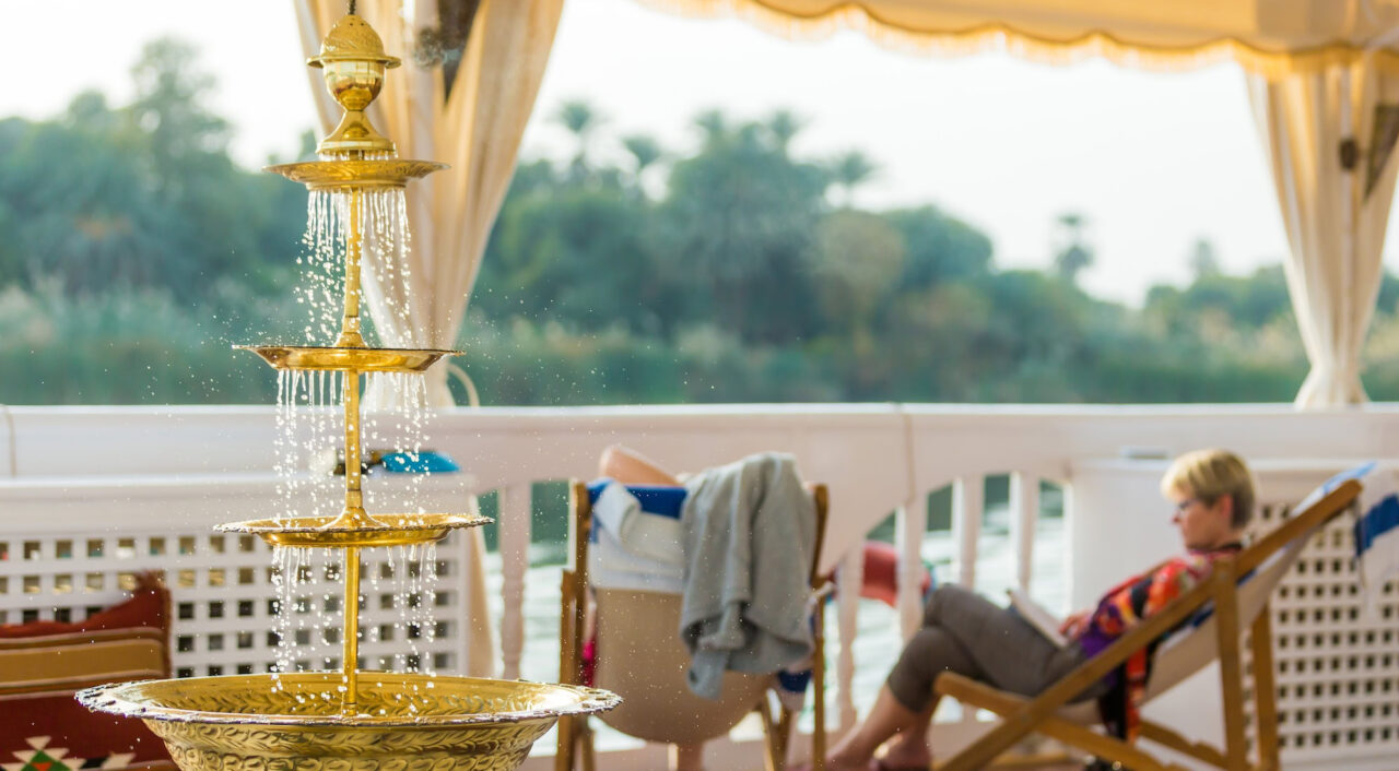 Outdoor lounge on MS Amoura Dahabiya overlooking the Nile