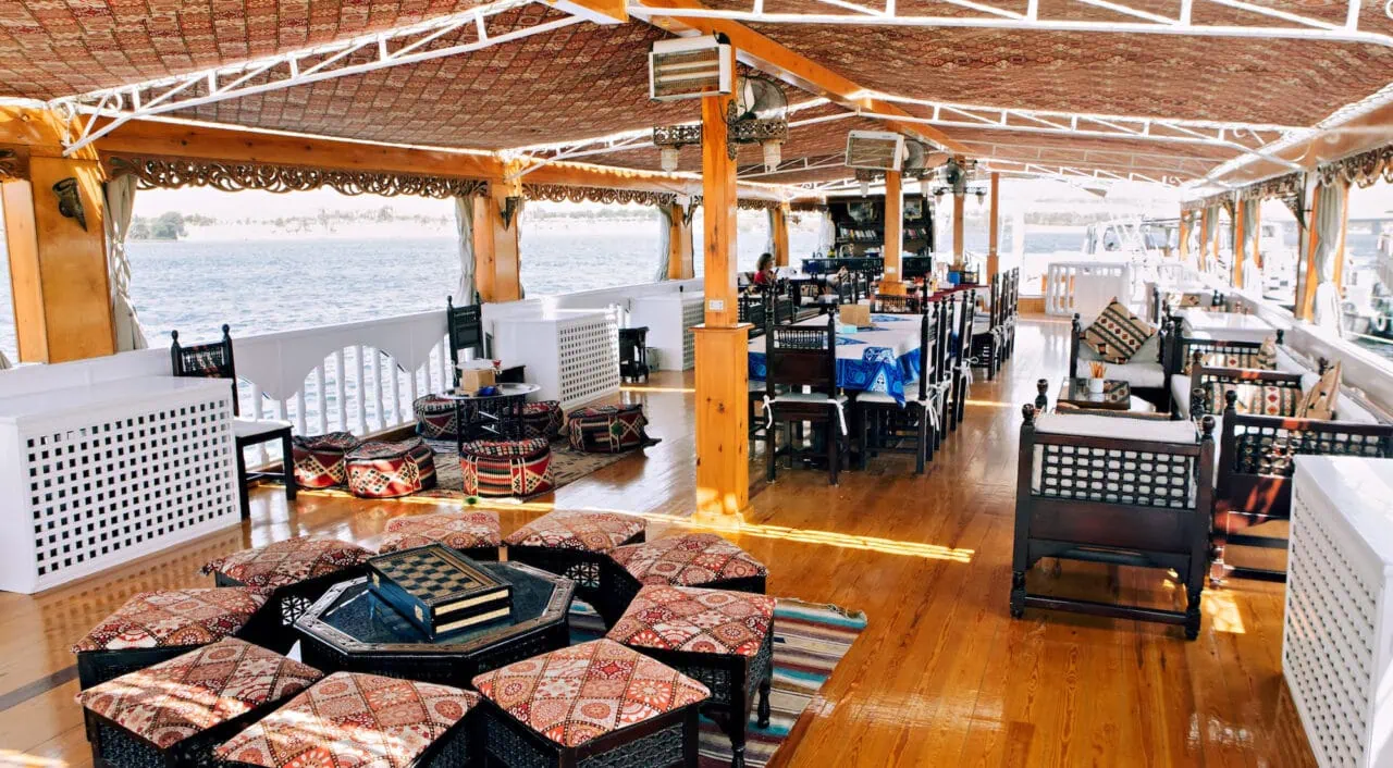 Outdoor lounge on MS Amoura Dahabiya overlooking the Nile