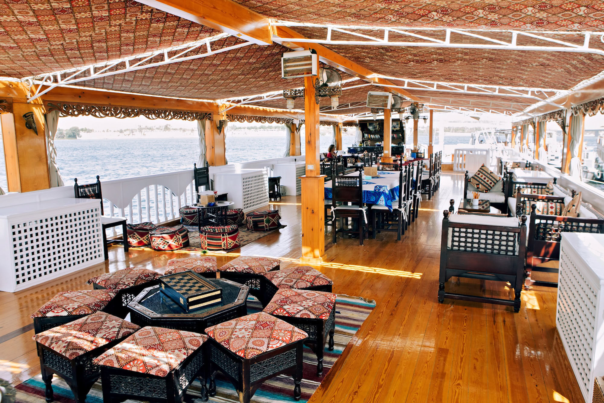 Outdoor lounge on MS Amoura Dahabiya overlooking the Nile