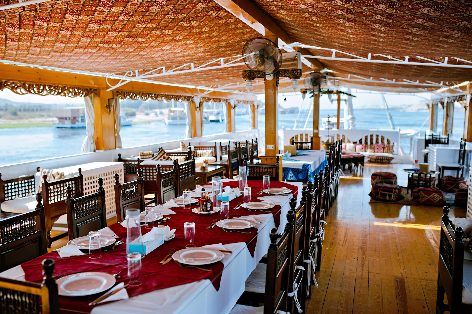 Outdoor dining setup on MS Amoura Dahabiya deck