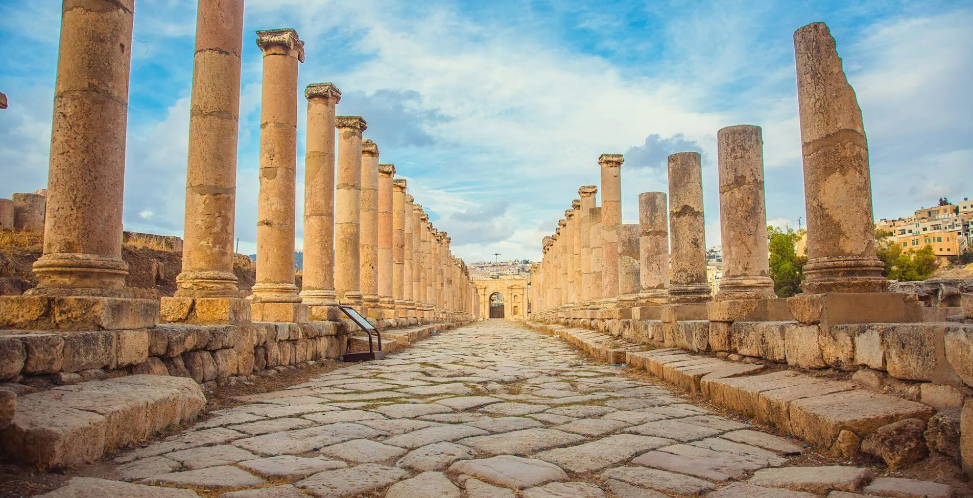 Ancient Roman ruins walkway along the columns in Jerash Jordan 1905x976 crop 50 51
