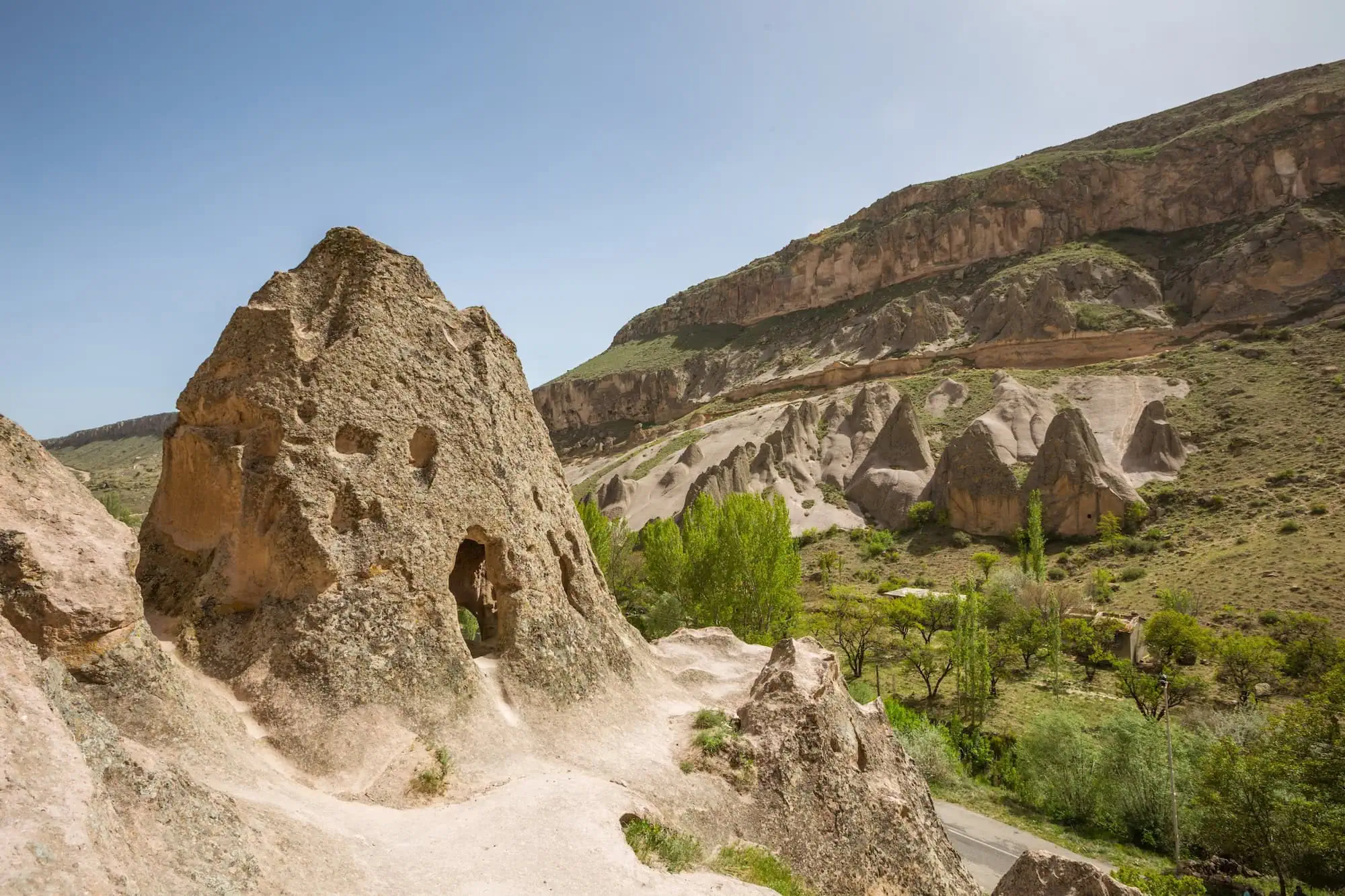 Fairy chimneys and cave dwellings in Cappadocia valley landscape