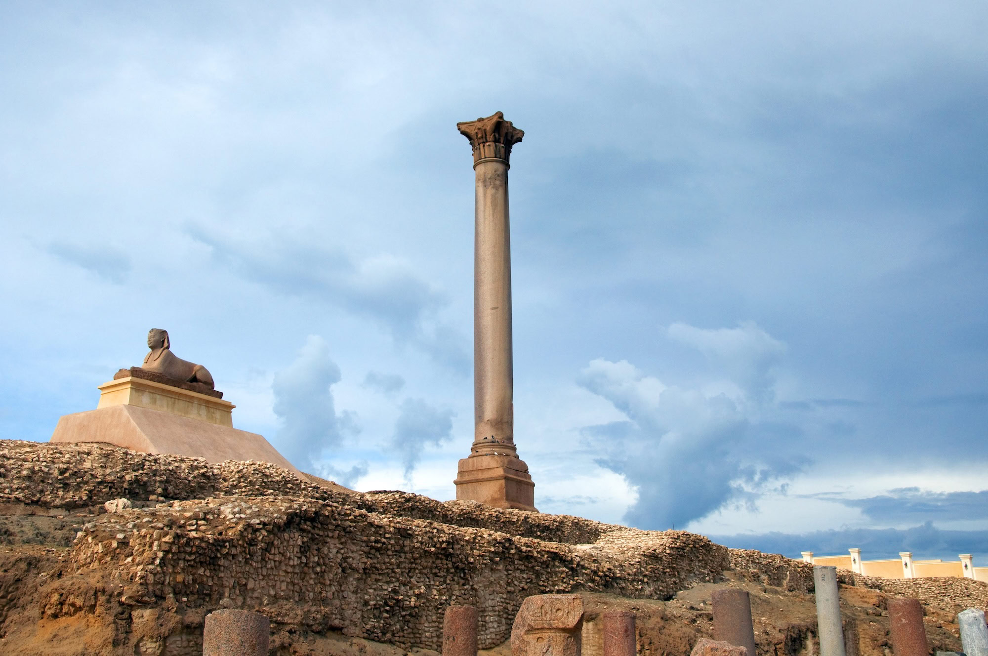 Pompey's Pillar in Alexandria showing Roman Corinthian column capital and ancient ruins
