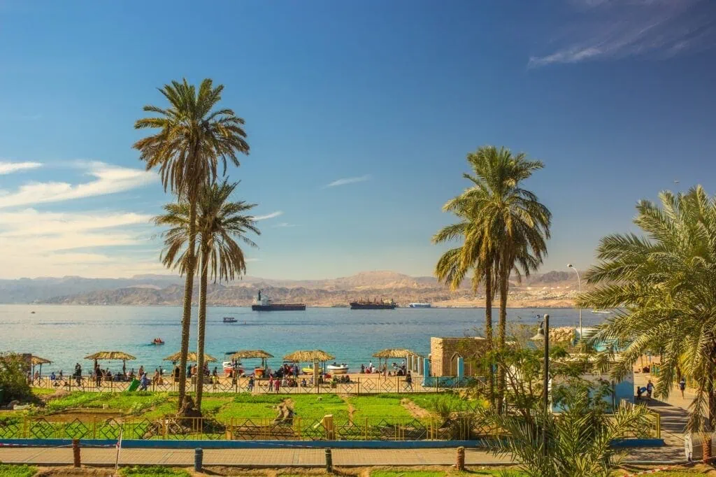 Aqaba waterfront park with palm trees and views of the Red Sea bay, Aqaba