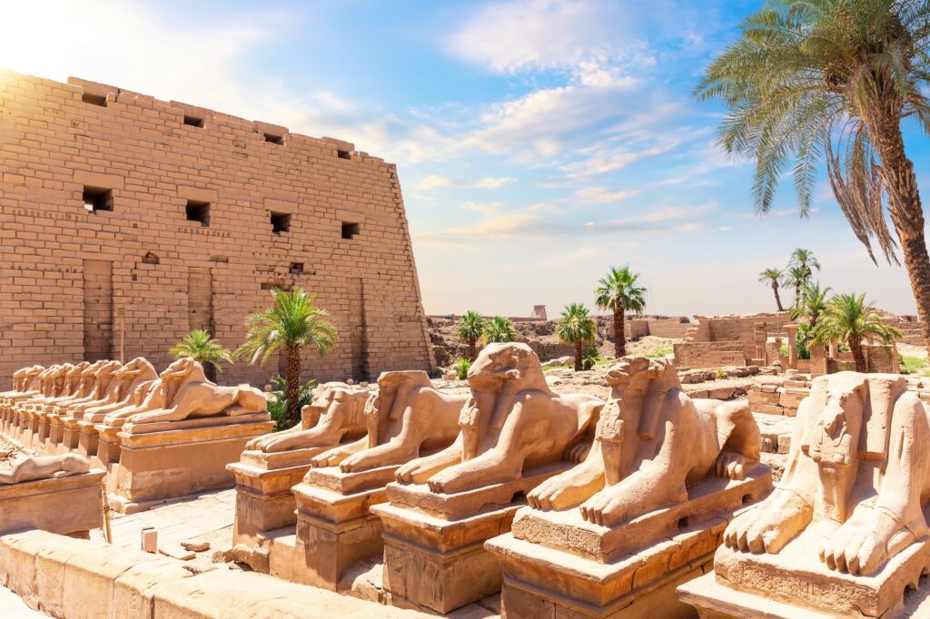Ram-headed sphinx statues lining the Festivities Road, also known as the Avenue of Sphinxes, at Karnak Temple, Luxor