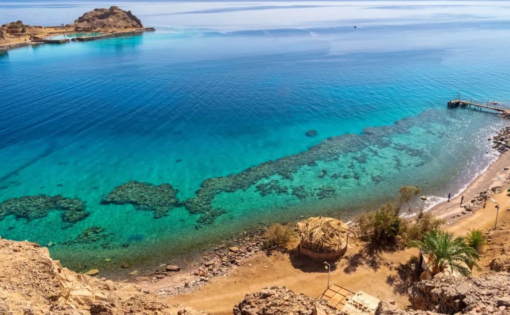 Taba coastline with clear Red Sea waters and mountainous shoreline, Taba
