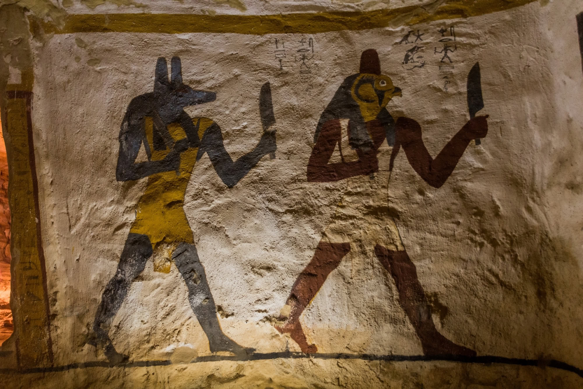 Ancient Egyptian tomb wall paintings showing hieroglyphs and ceremonial figures at Tell El Amarna