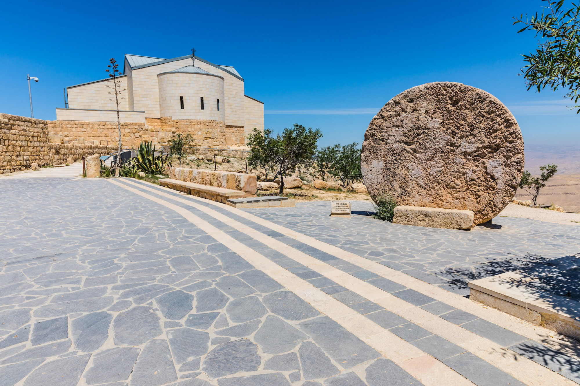 Mount Nebo Memorial Church with ancient stone architecture and desert landscape view in Jordan
