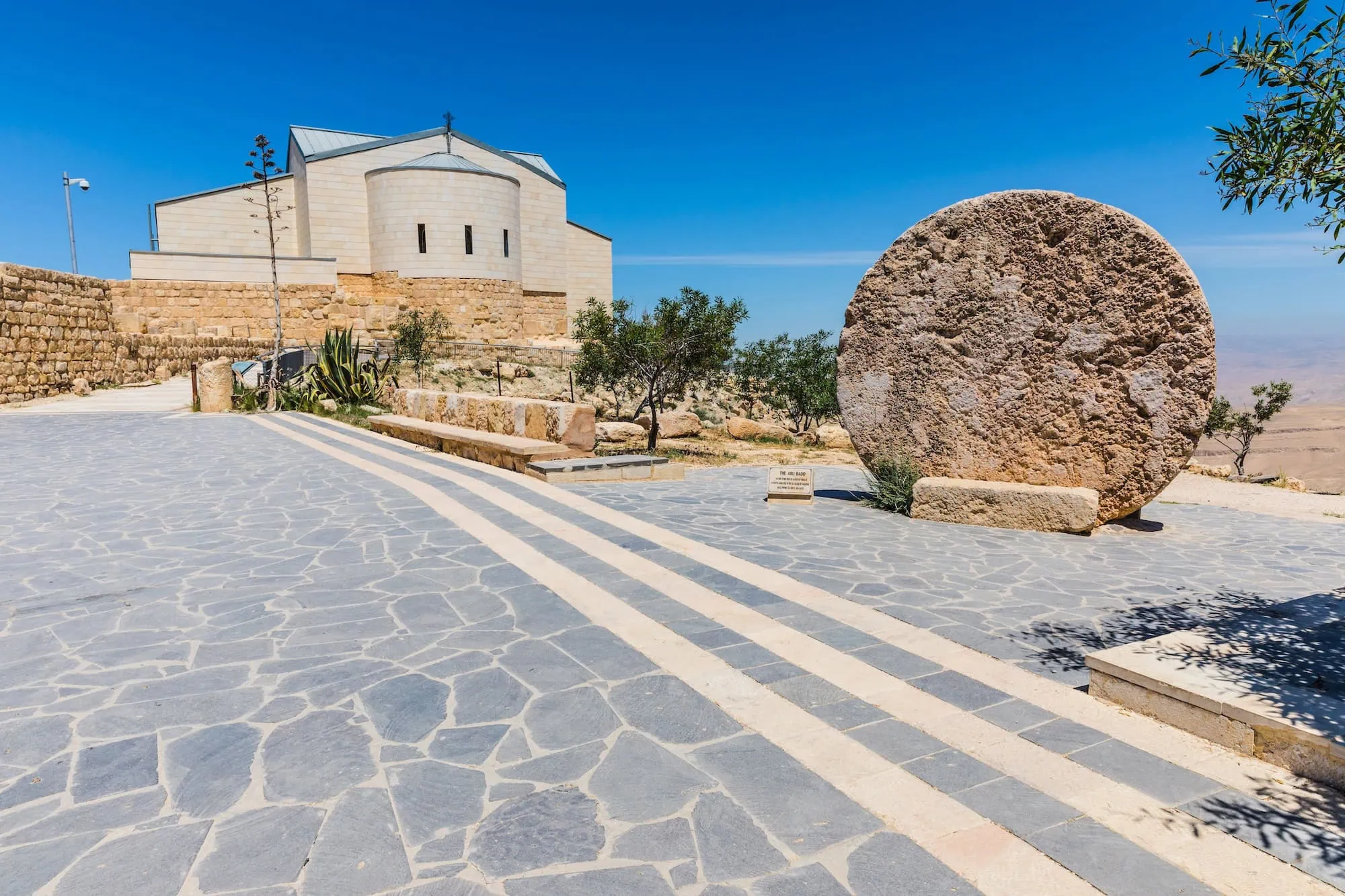 Mount Nebo Memorial Church with ancient stone architecture and desert landscape view in Jordan