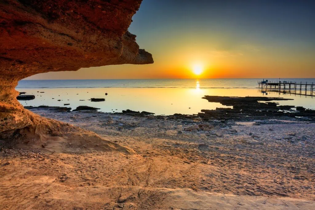 Sunrise view over the Red Sea coastline with rocky shore and calm waters, Marsa Alam