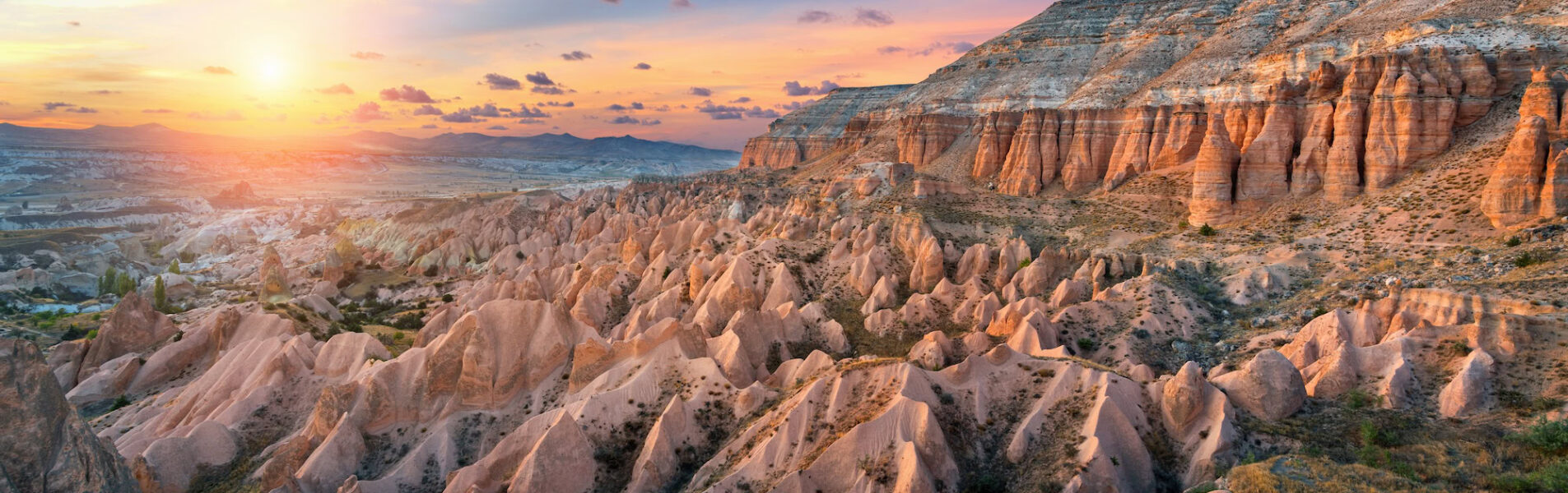 Beautiful mountains and Red valley at sunset in Goreme, Cappadocia in Turkey