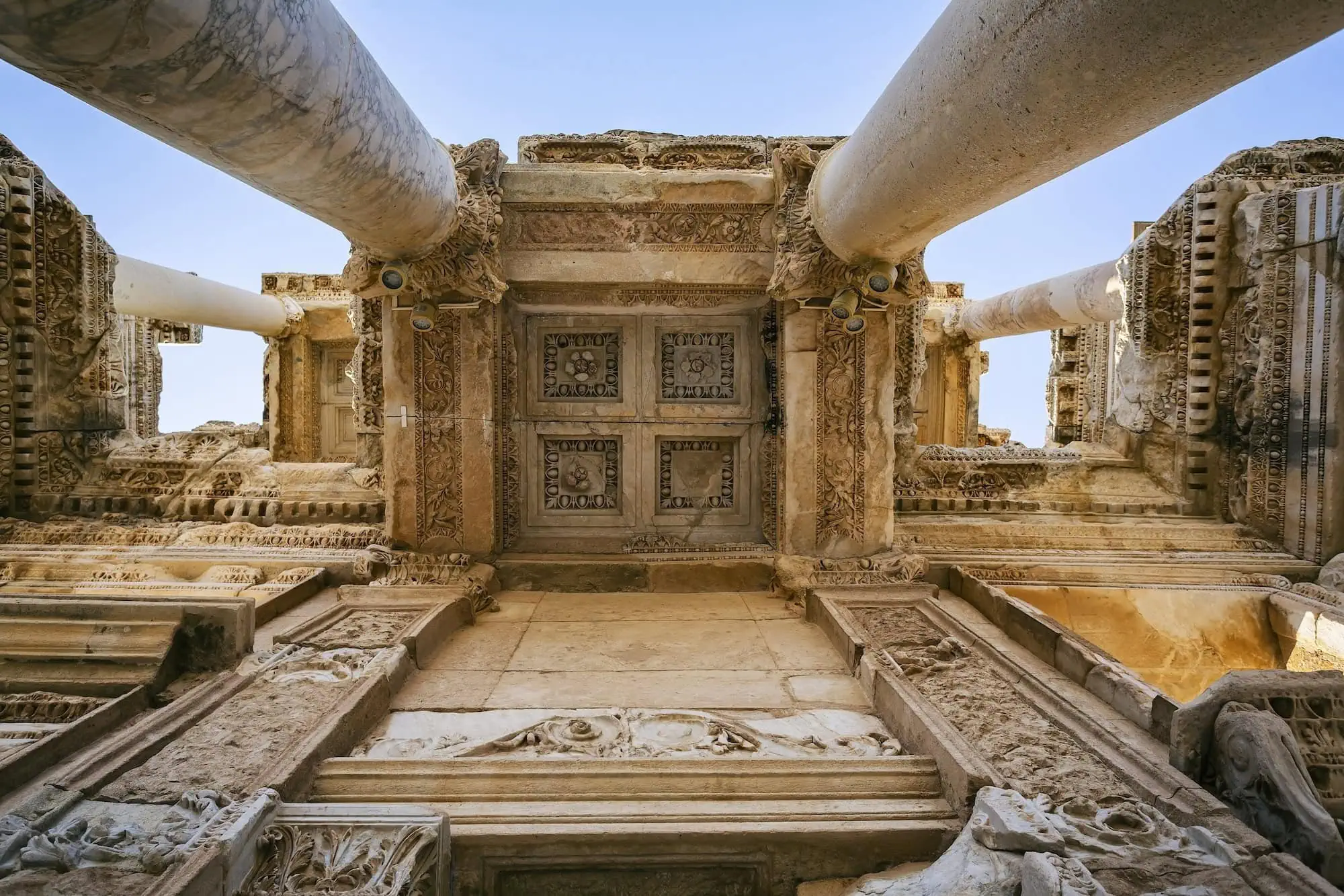 Ancient Library of Celsus facade with ornate columns and carved stone architecture in Ephesus, Turkey