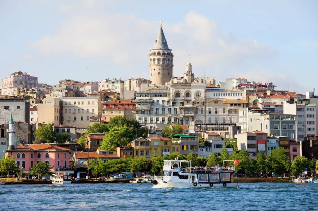 Galata Tower overlooking waterfront buildings and boats Istanbul