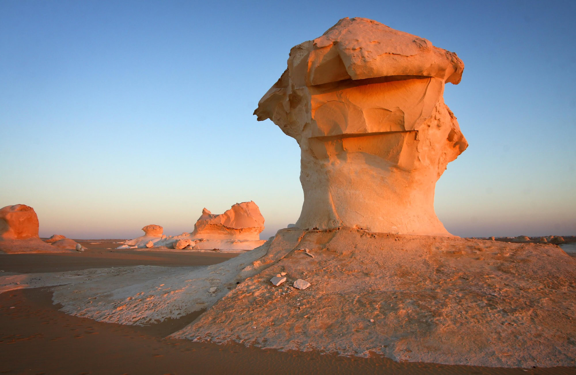 Mushroom-shaped white chalk rock formations in Egypt's White Desert