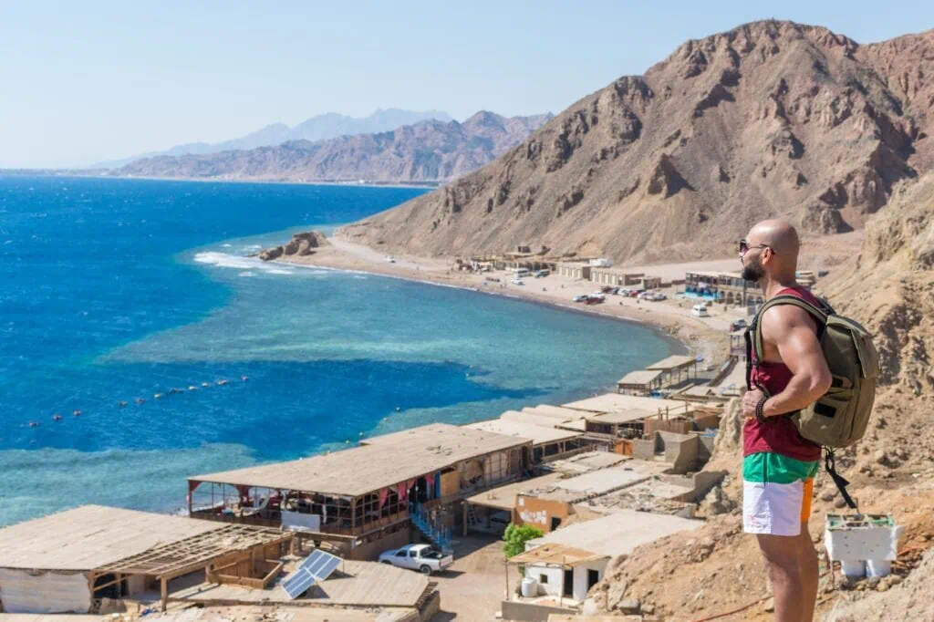 Blue Hole dive site with circular reef formation and surrounding coastline seen from above, Dahab