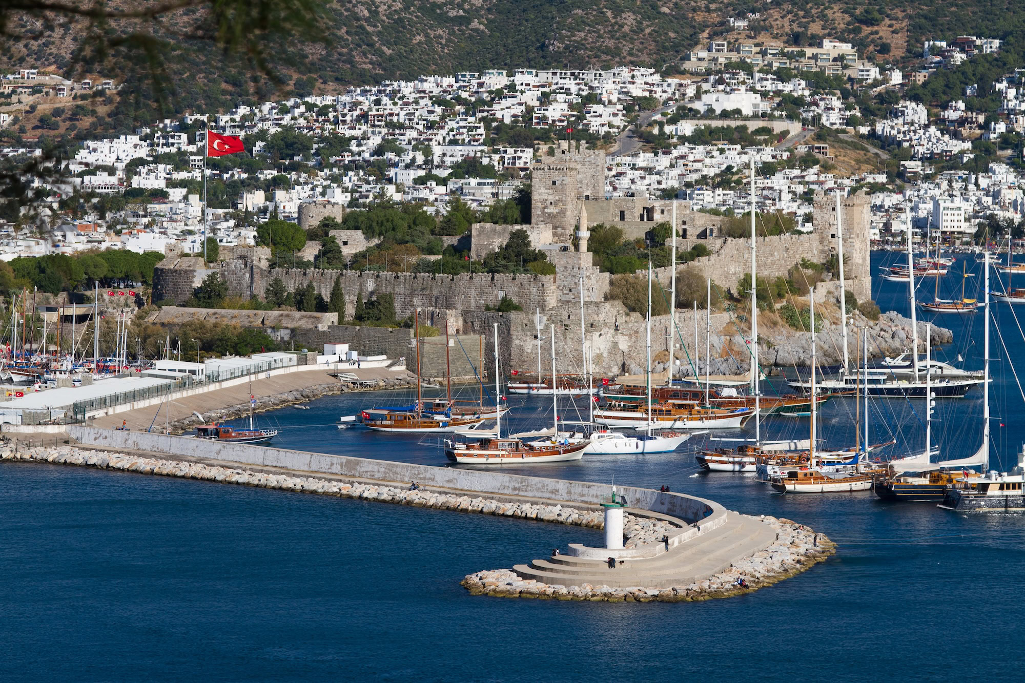 Aerial view of Bodrum Castle overlooking the harbor with boats and Mediterranean Sea