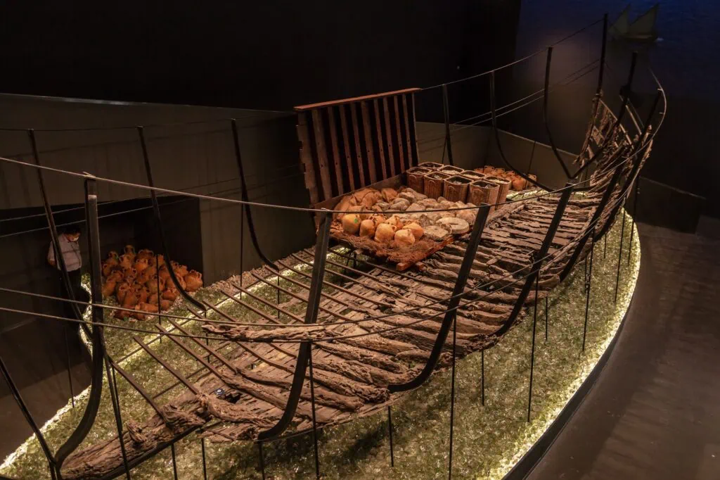 Bodrum Underwater Archaeology Museum shipwreck exhibit with wooden hull remains and amphorae cargo display Bodrum