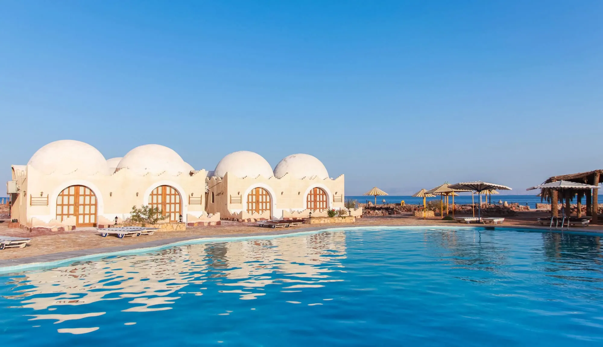 Resort bungalows with pool in Dahab, Egypt showing tourist accommodation in southern Sinai