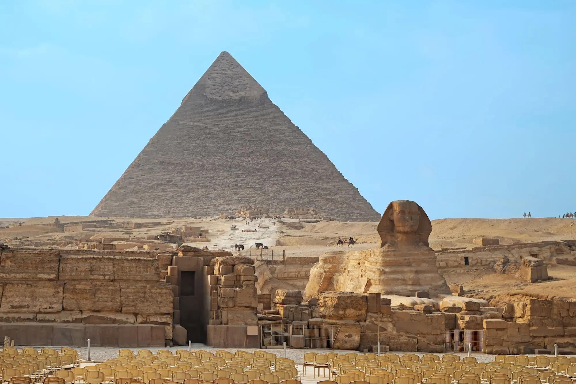 Great Sphinx of Giza with Chephren pyramid in background on desert plateau