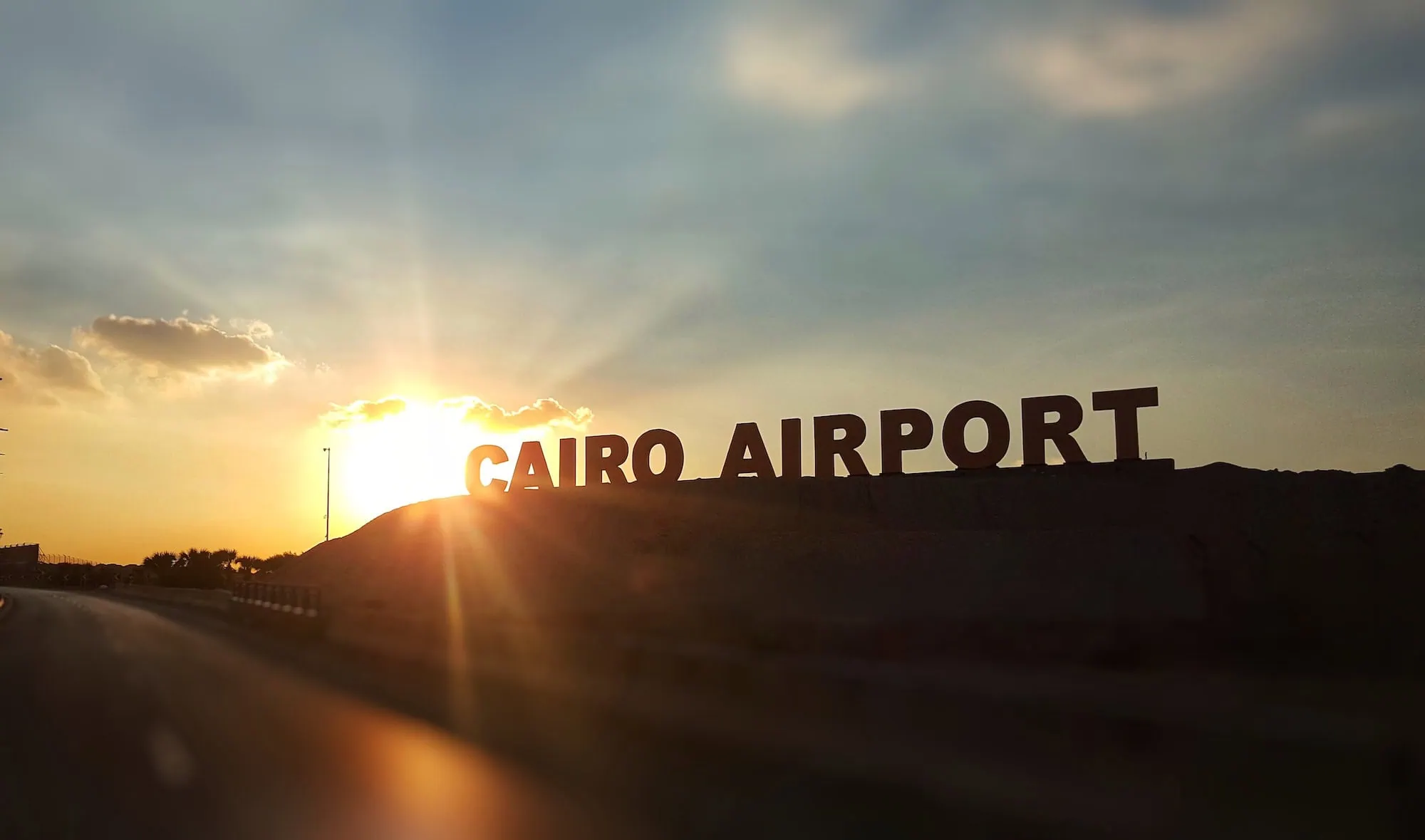 Cairo Airport sign with scenic landscape view