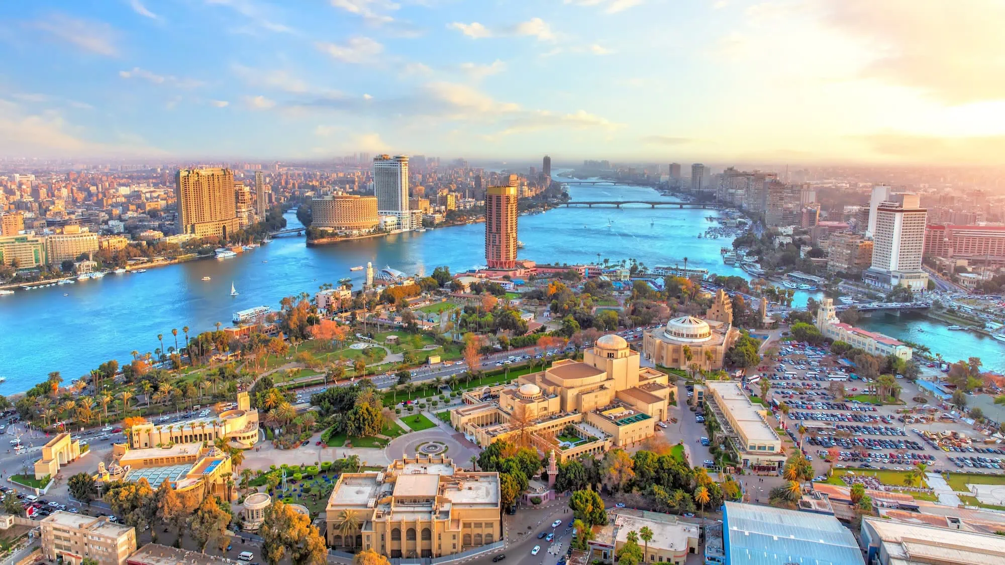 Aerial view of Cairo cityscape with the Nile River flowing through downtown district at golden hour