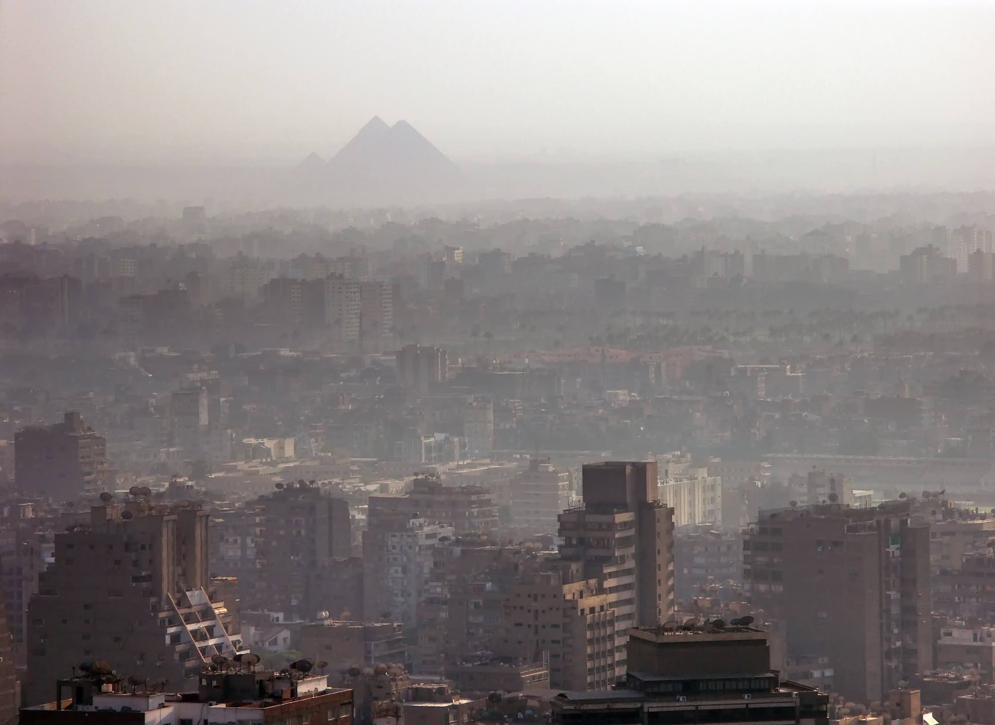 The Great Pyramids of Giza viewed from Cairo showing the ancient monuments near the modern city