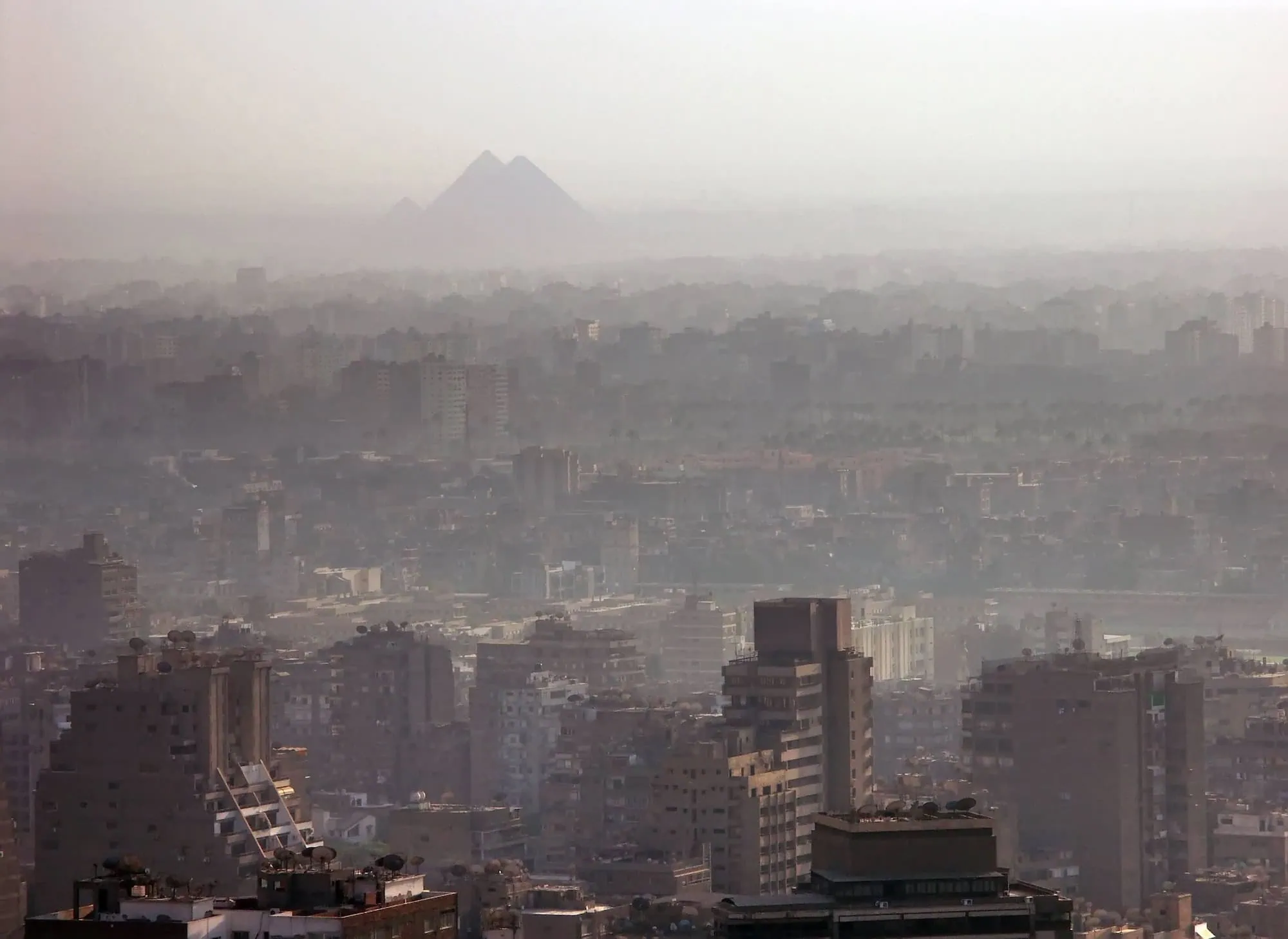 The Great Pyramids of Giza viewed from Cairo showing the ancient monuments near the modern city