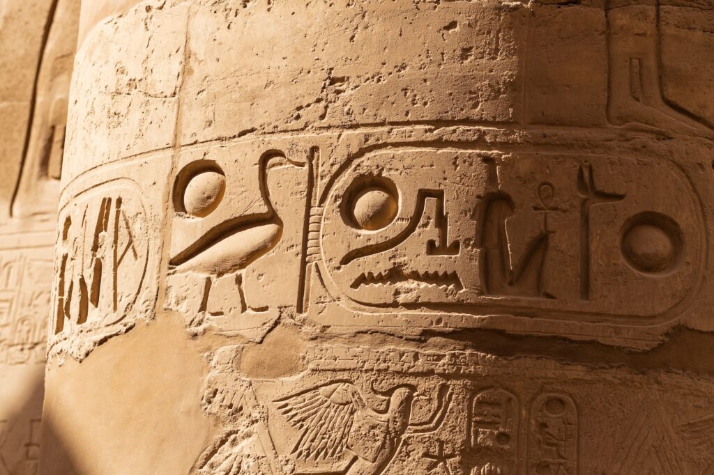 Cartouche carved among hieroglyphics on columns in the Great Hypostyle Hall of Karnak Temple, Luxor