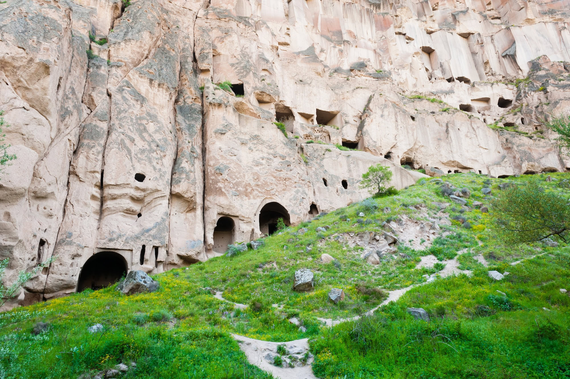 Ancient cave dwellings carved into rock formations in Cappadocia
