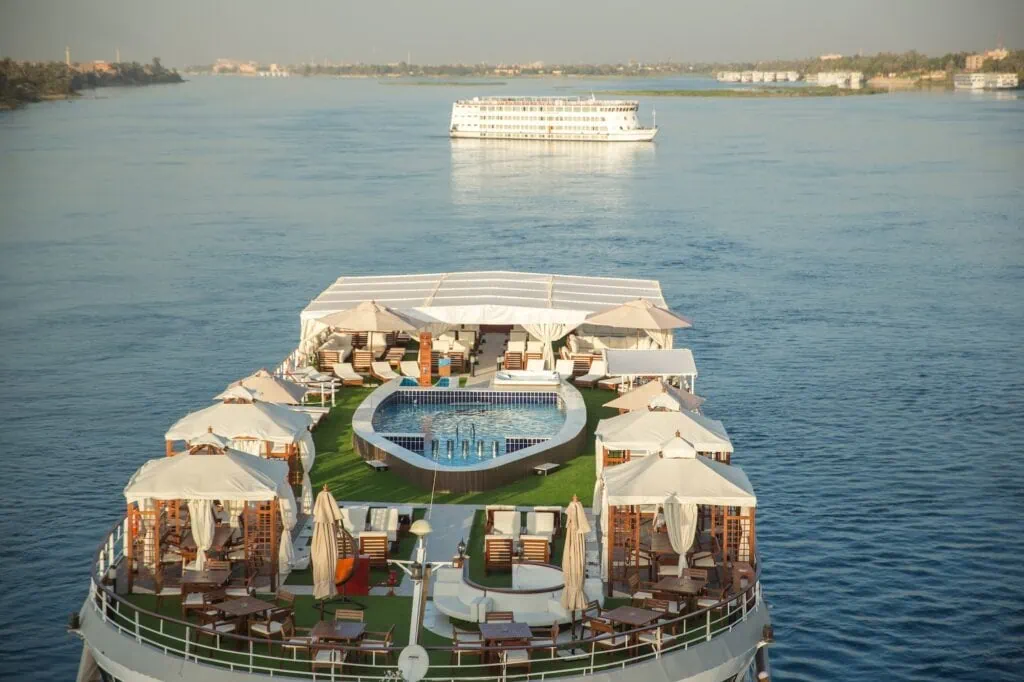 Rooftop swimming pool with sun loungers on a Nile cruise ship deck