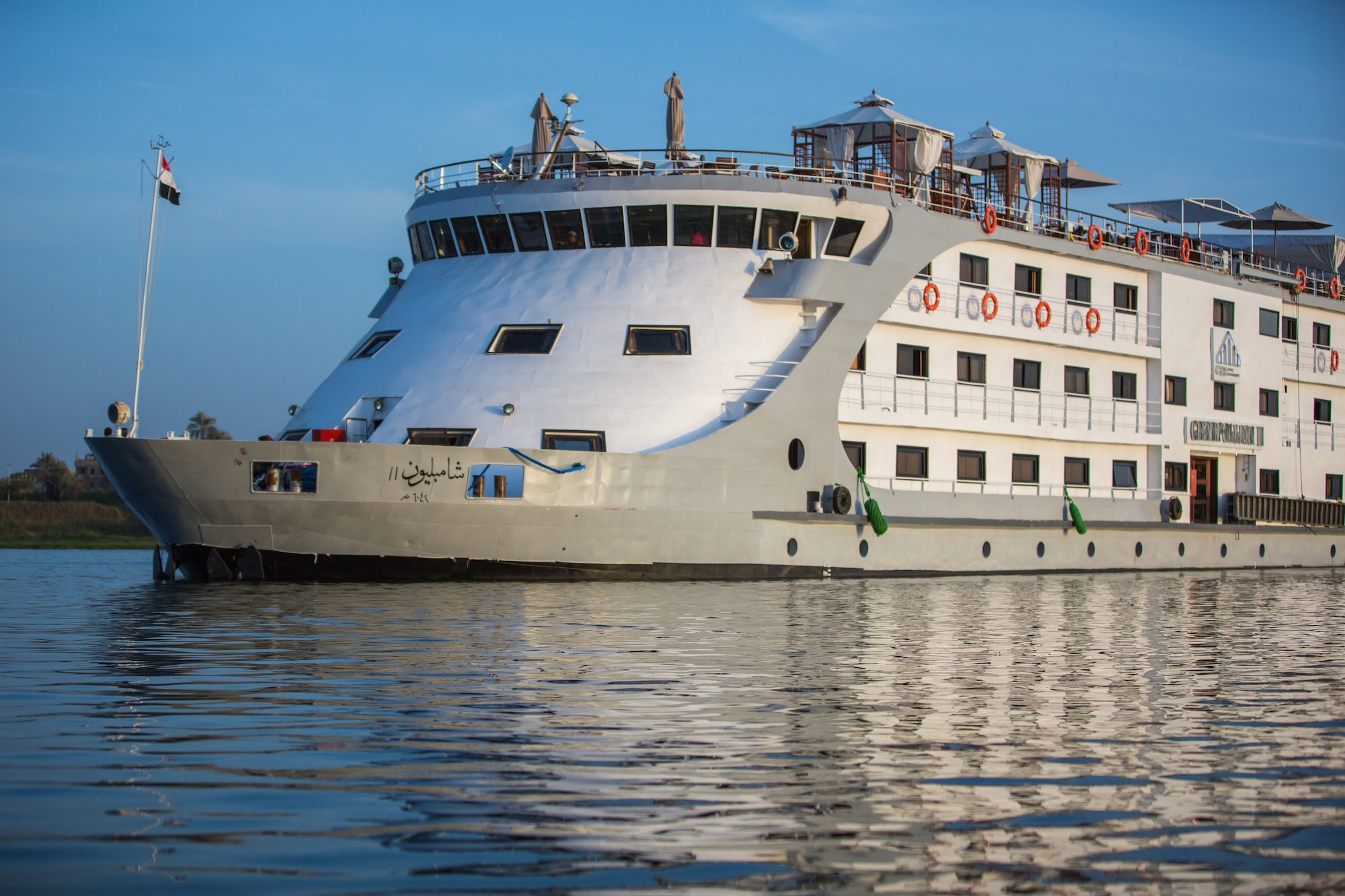 Nile River cruise ship with visible life rings and safety equipment on deck