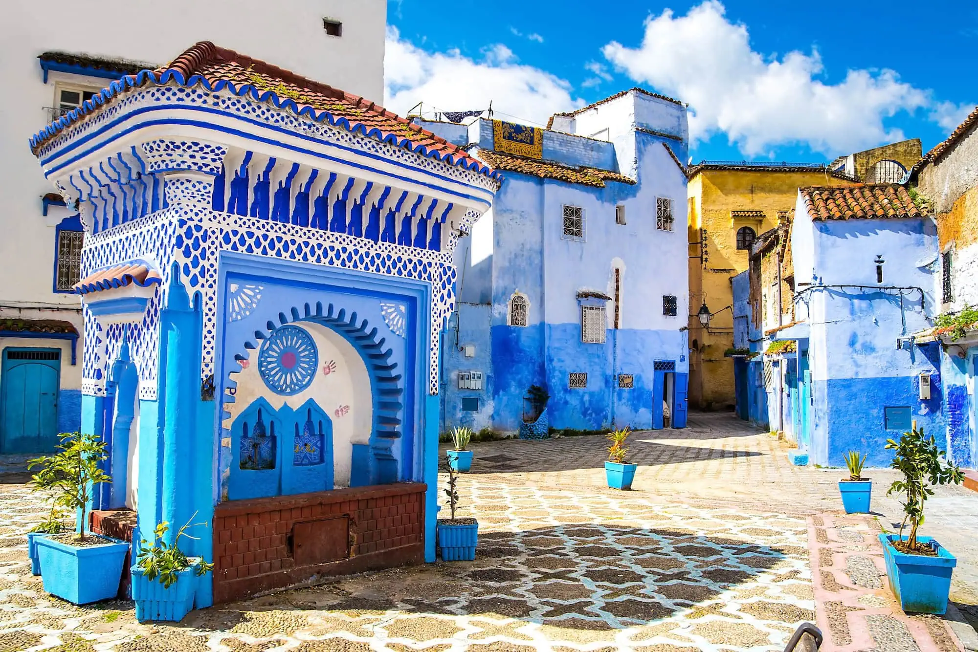 Traditional blue and white painted buildings with Islamic geometric patterns in Chefchaouen, Morocco