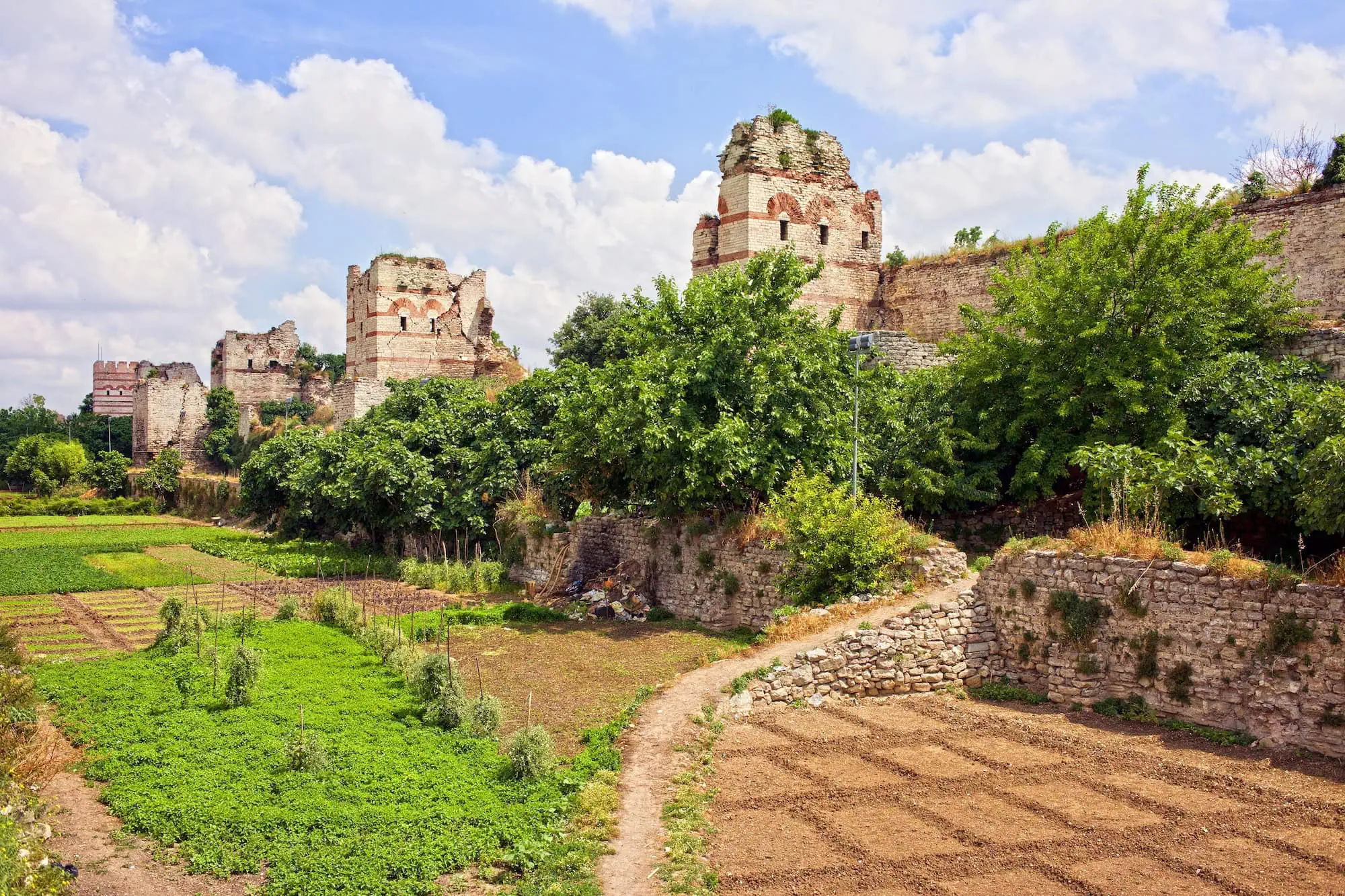 Ancient Byzantine walls of Constantinople with vegetable gardens in former moat area