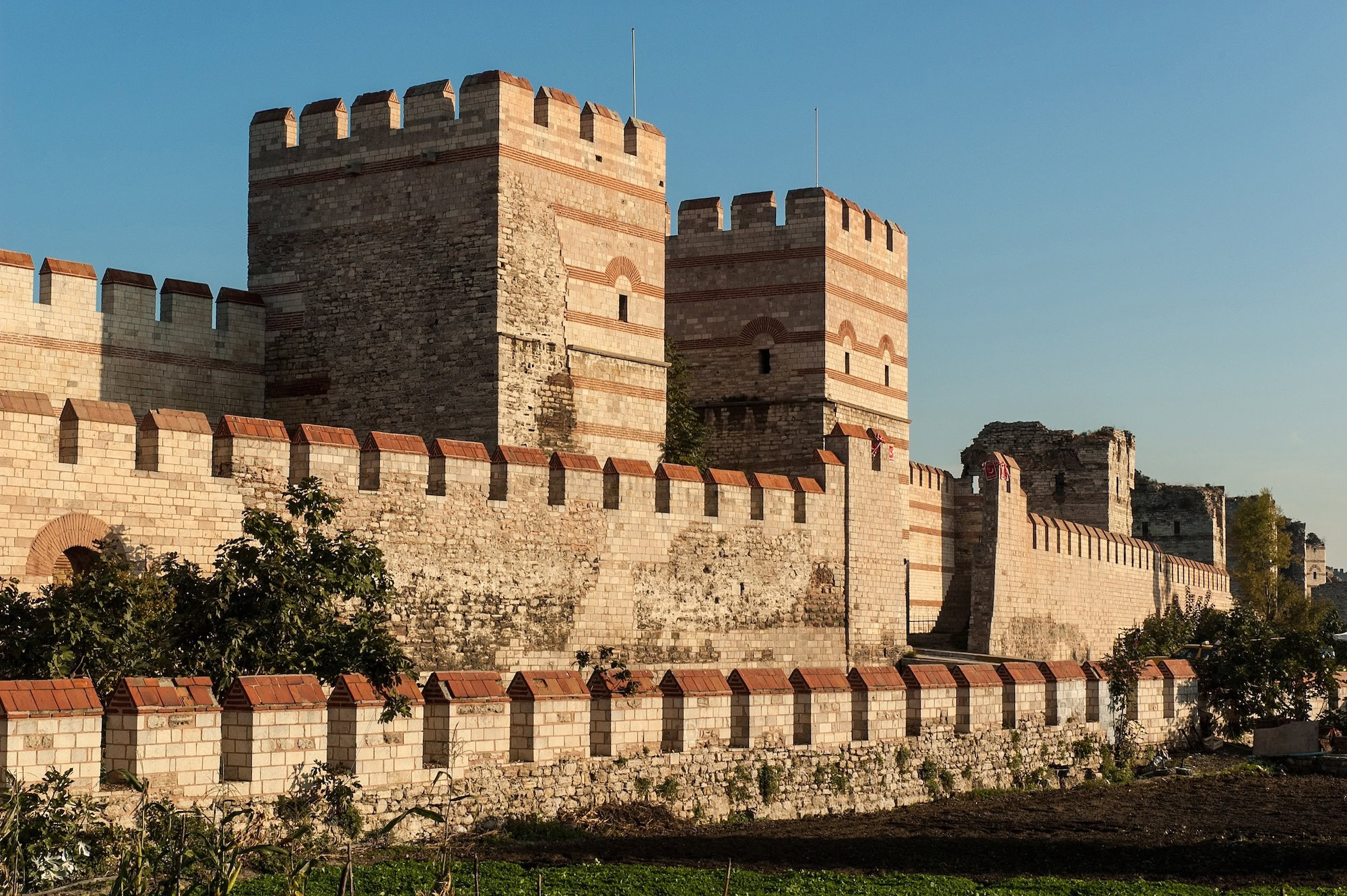 Ancient stone fortress walls and towers of Constantinople showing historical construction details