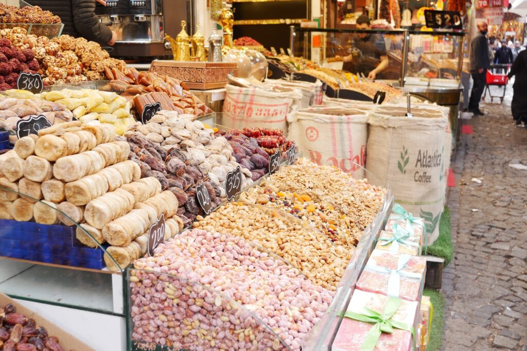 Colorful display of nuts and dried fruits at bustling market