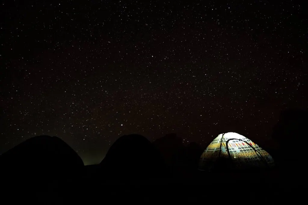 Tent on million star background at White desert in Bahariya Oasis