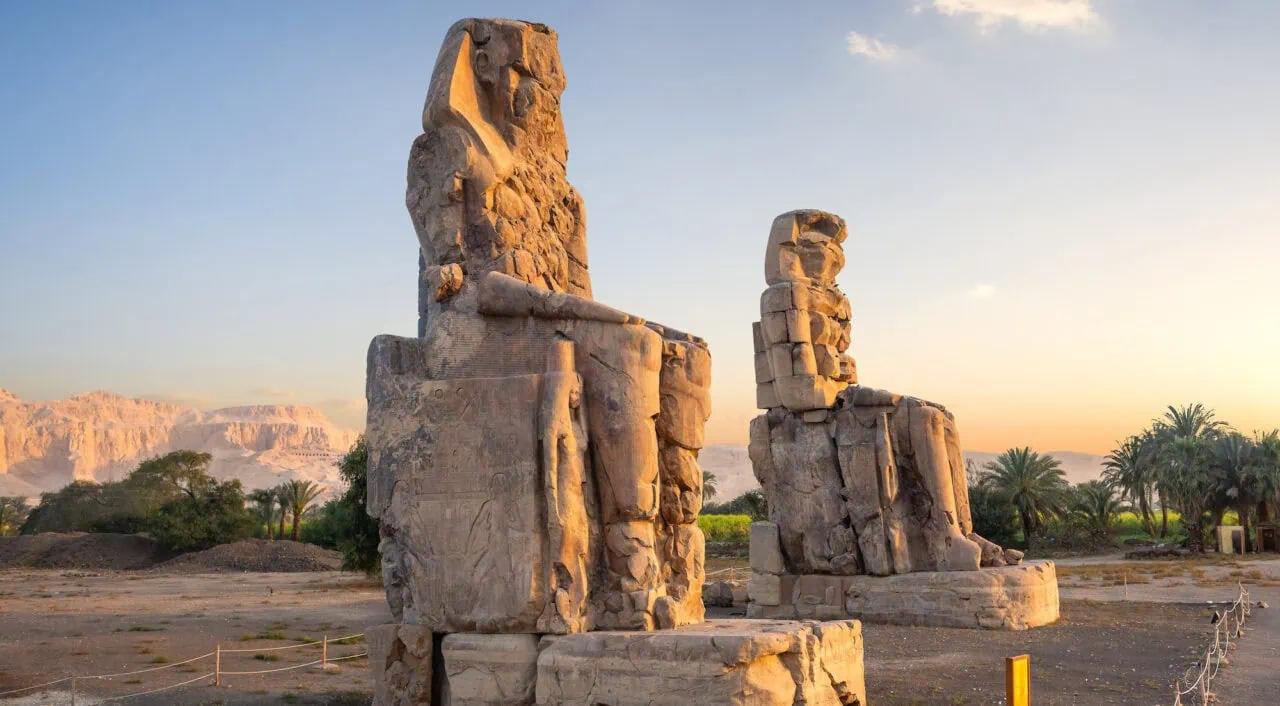 Colossi of Memnon in Luxor, Egypt – giant seated statues of Pharaoh Amenhotep III on the West Bank of the Nile