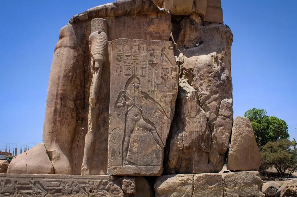 Close-up of hieroglyphs carved on the Colossi of Memnon stone statues of Pharaoh Amenhotep III, Luxor
